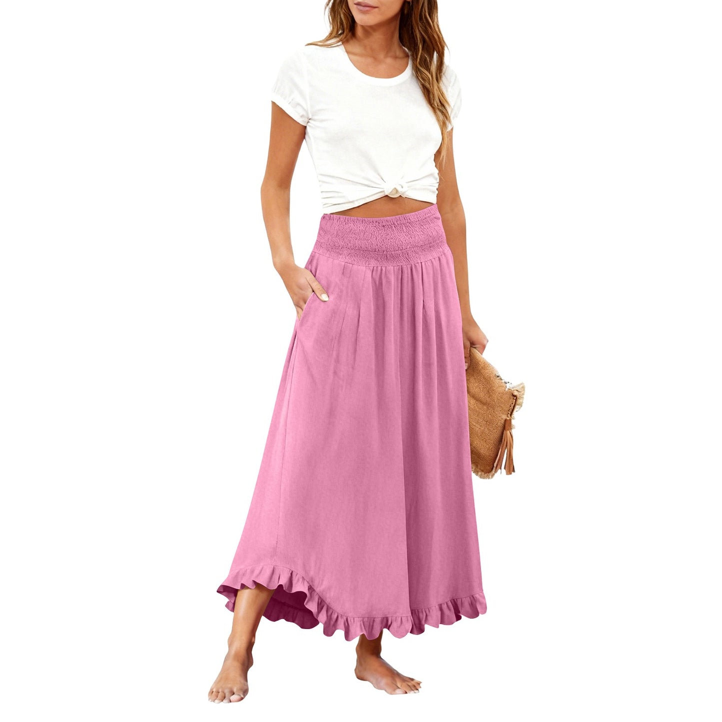 Woman wearing a white top and pink skirt on a white background