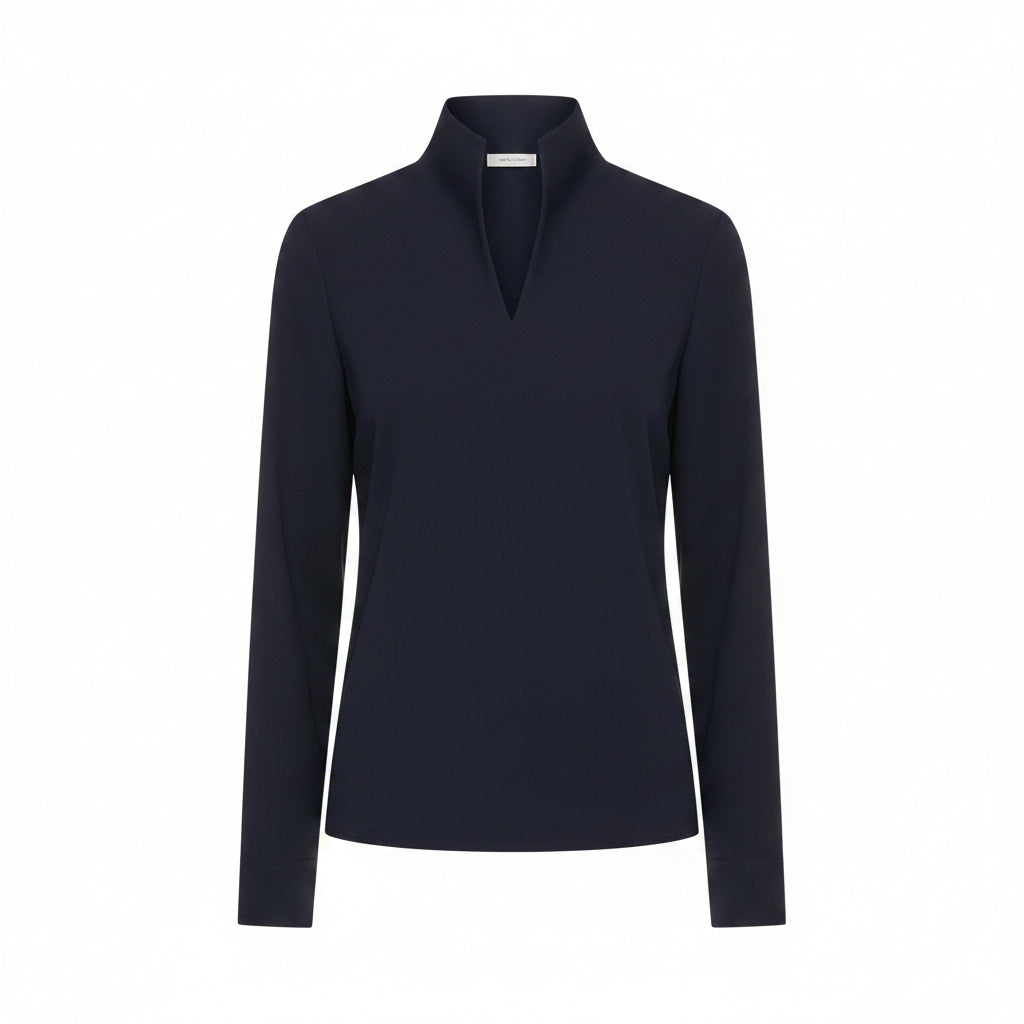 Person wearing a navy blue blouse with a blurred background