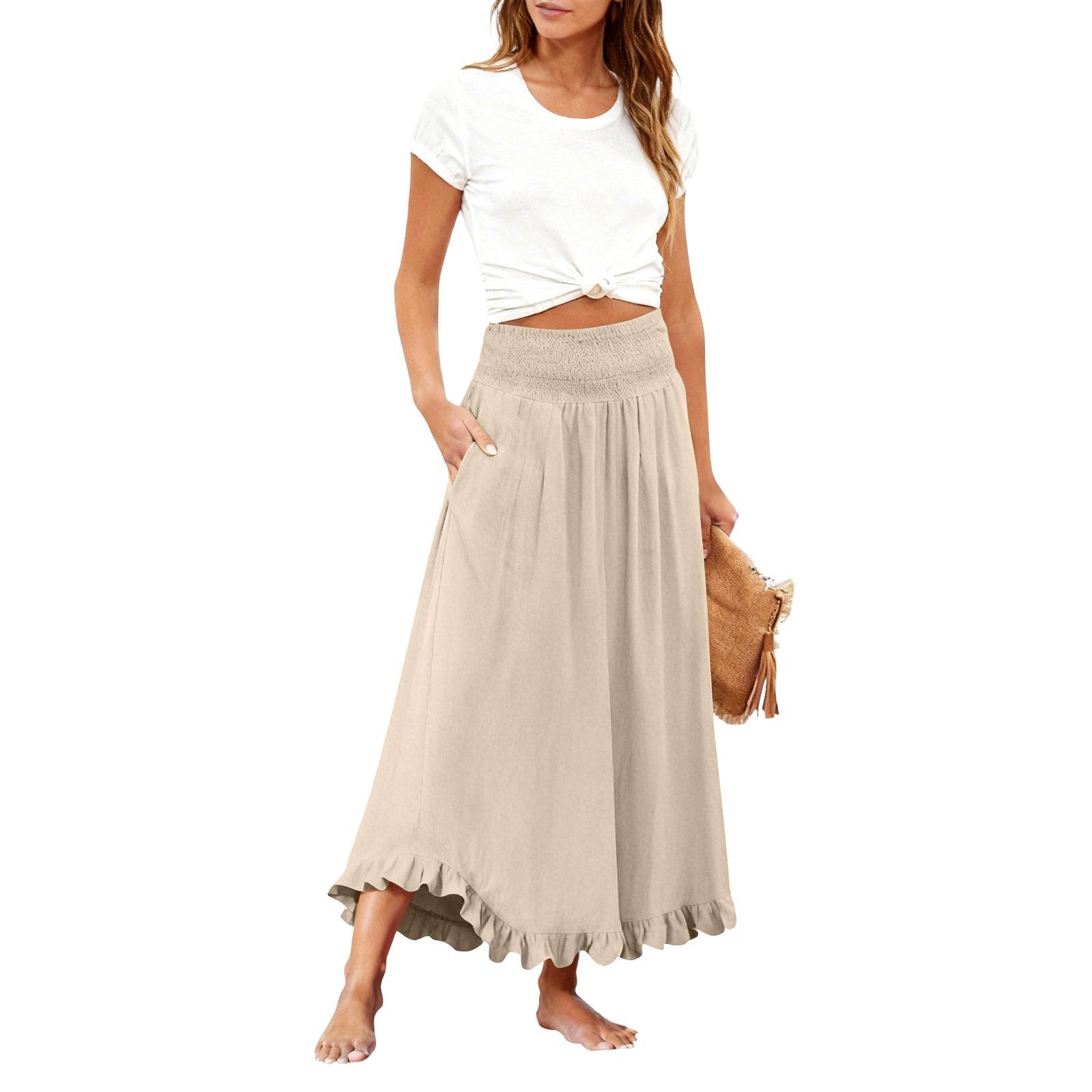 Woman wearing a white top and beige skirt on a white background