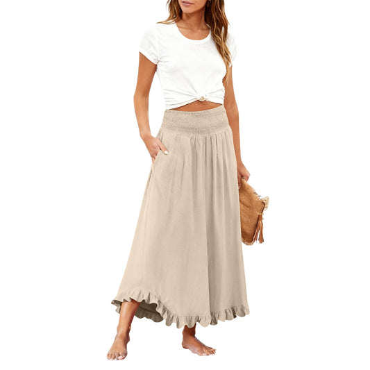 Woman wearing a white top and beige skirt on a white background