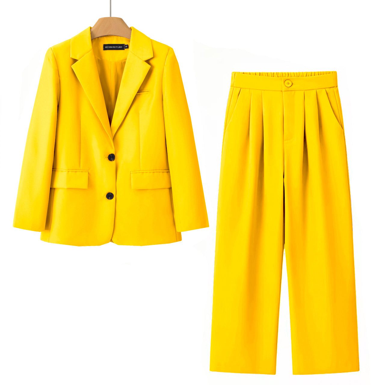 A bright yellow two-piece women's outfit set consisting of a double-breasted blazer on a wooden hanger and matching pleated wide-leg trousers, displayed against a solid white background.