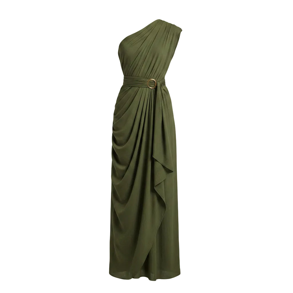 Woman wearing a green one-shoulder dress against a beige wall