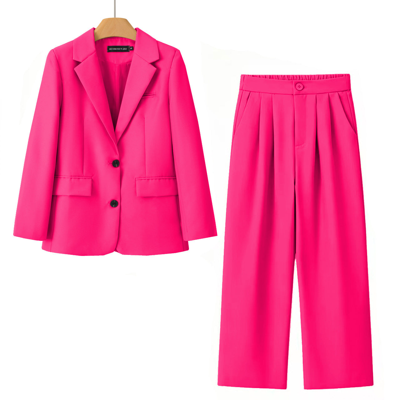A bright pink two-piece women's suit set featuring a double-breasted blazer on a wooden hanger and matching pleated wide-leg trousers, displayed against a solid white background.
