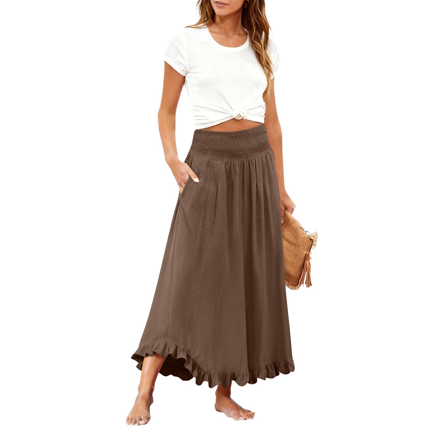 Woman wearing a white top and brown long skirt on a white background
