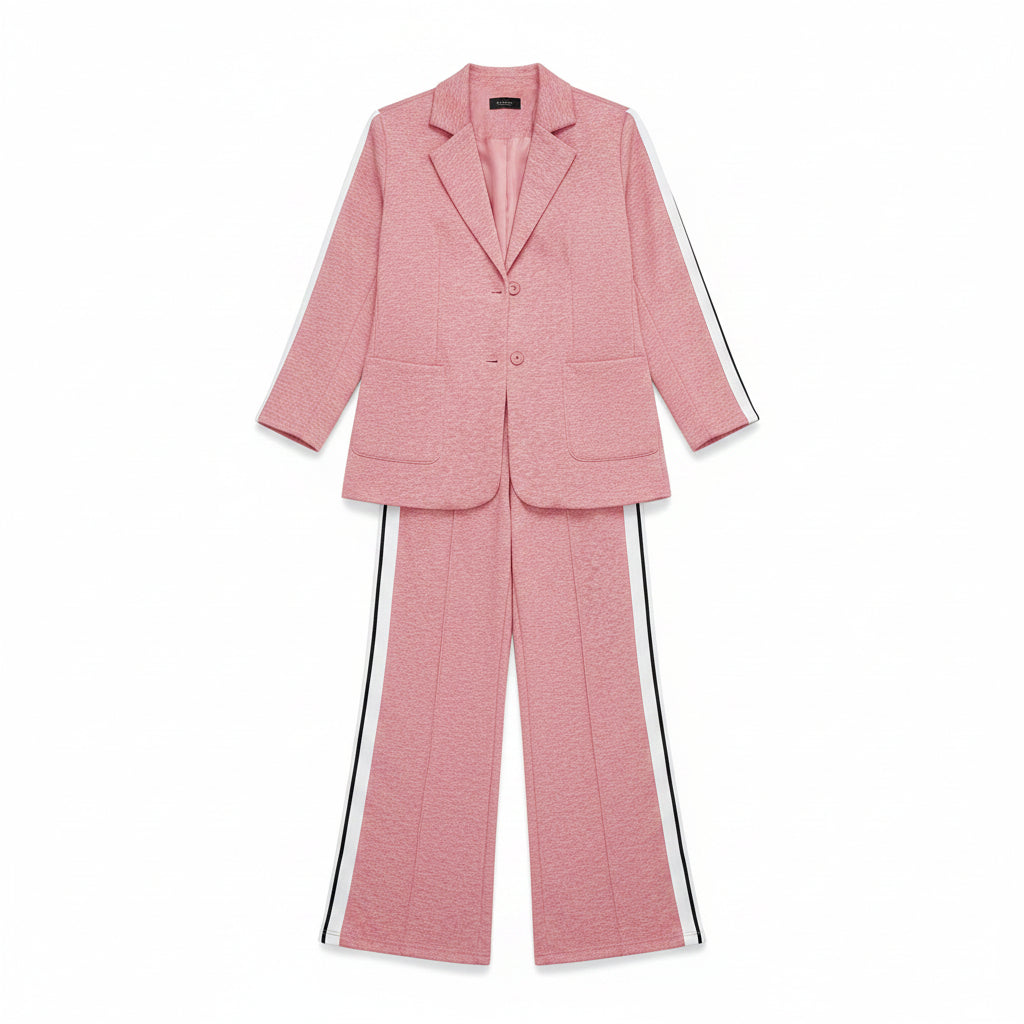 Woman in a pink outfit standing in front of a wardrobe with shoes.
