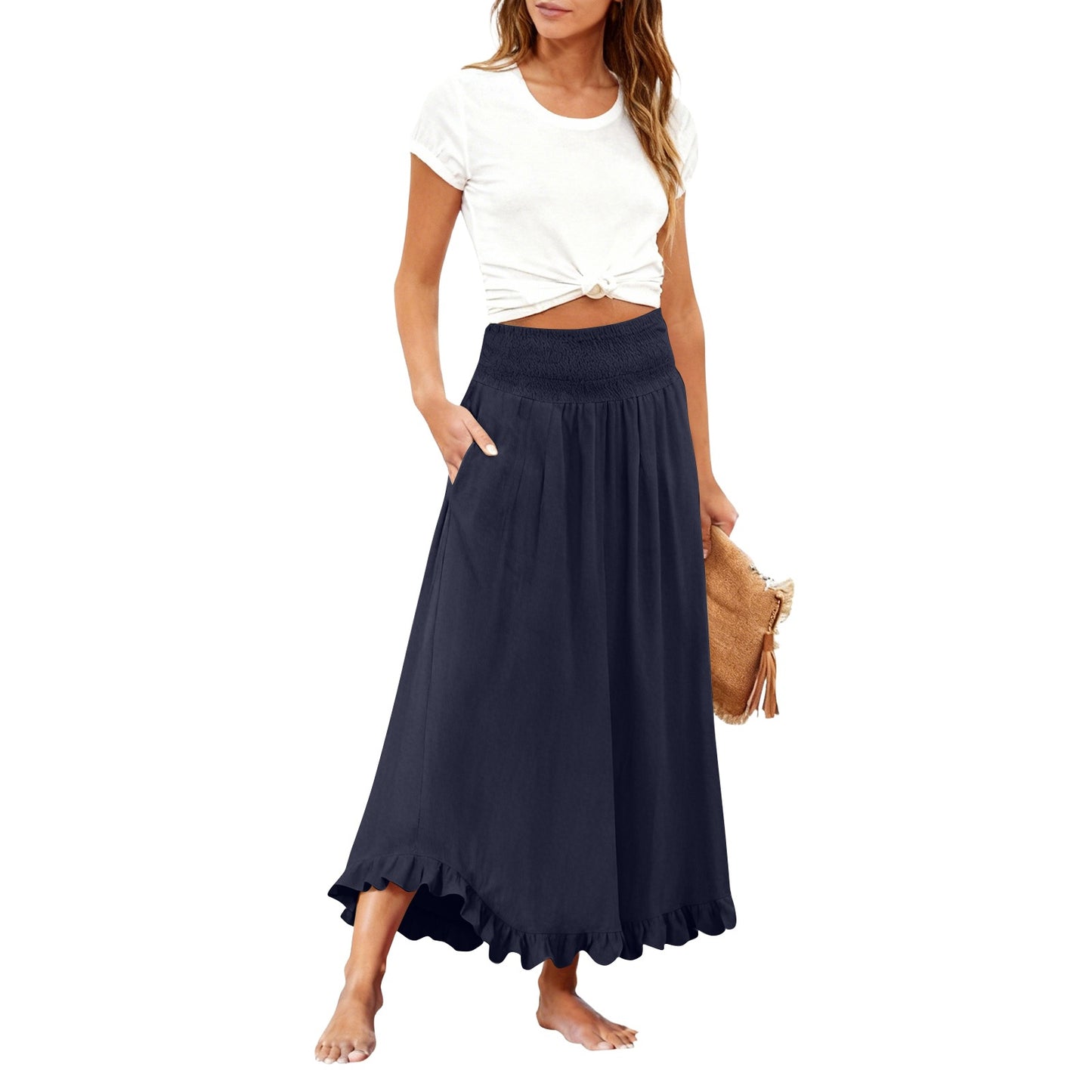 Woman wearing a black skirt and white top on a white background