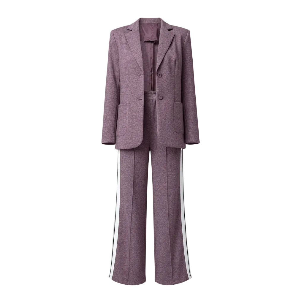 Woman in a purple suit with white stripes standing in a closet.