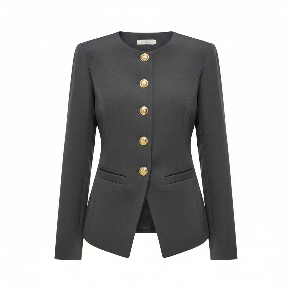 A woman wearing a dark gray long-sleeve blazer with decorative silver-tone buttons down the front and flap pockets, paired with black pants.