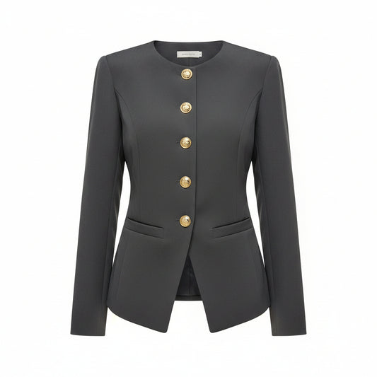 A woman wearing a dark gray long-sleeve blazer with decorative silver-tone buttons down the front and flap pockets, paired with black pants.