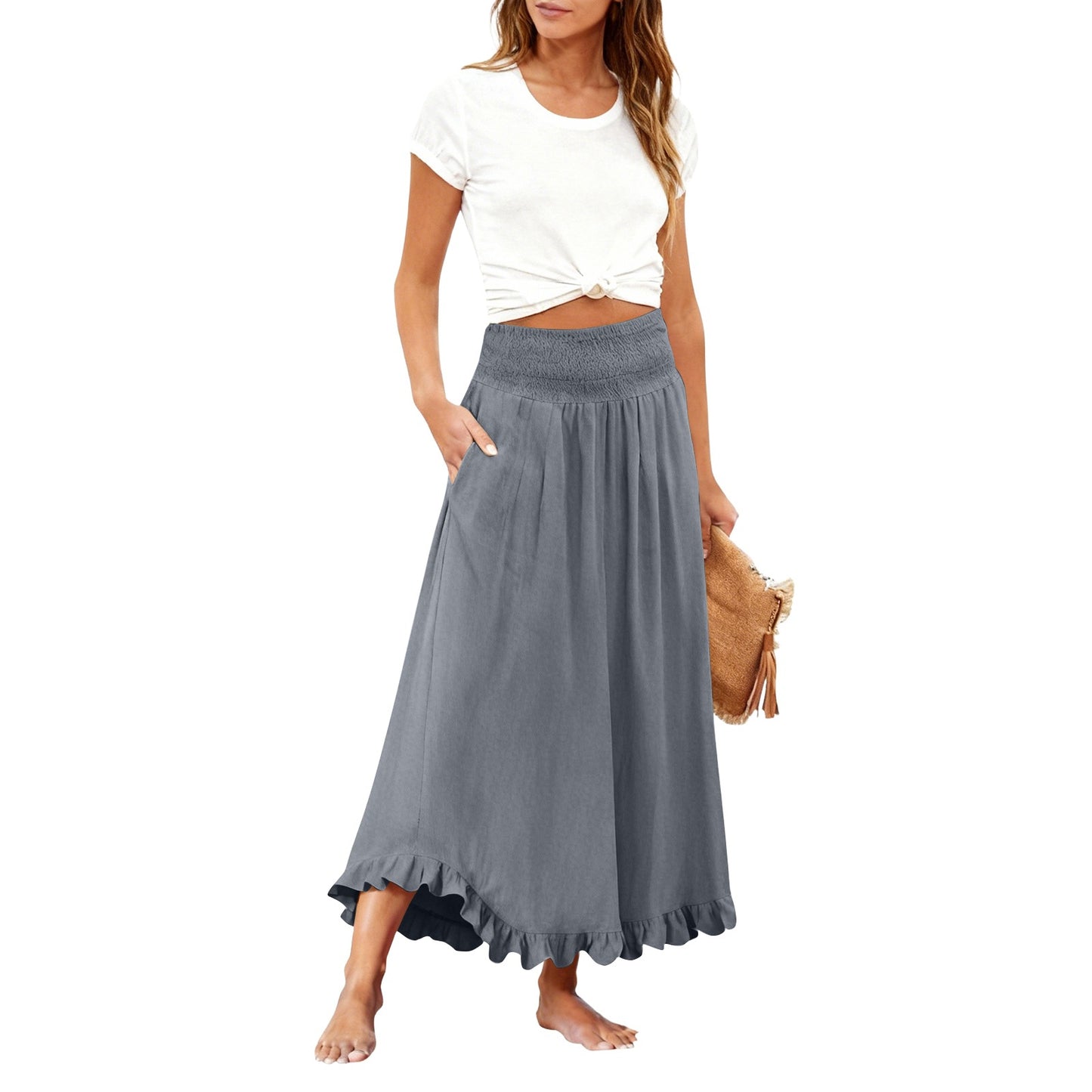 Woman wearing a white top and gray skirt on a white background