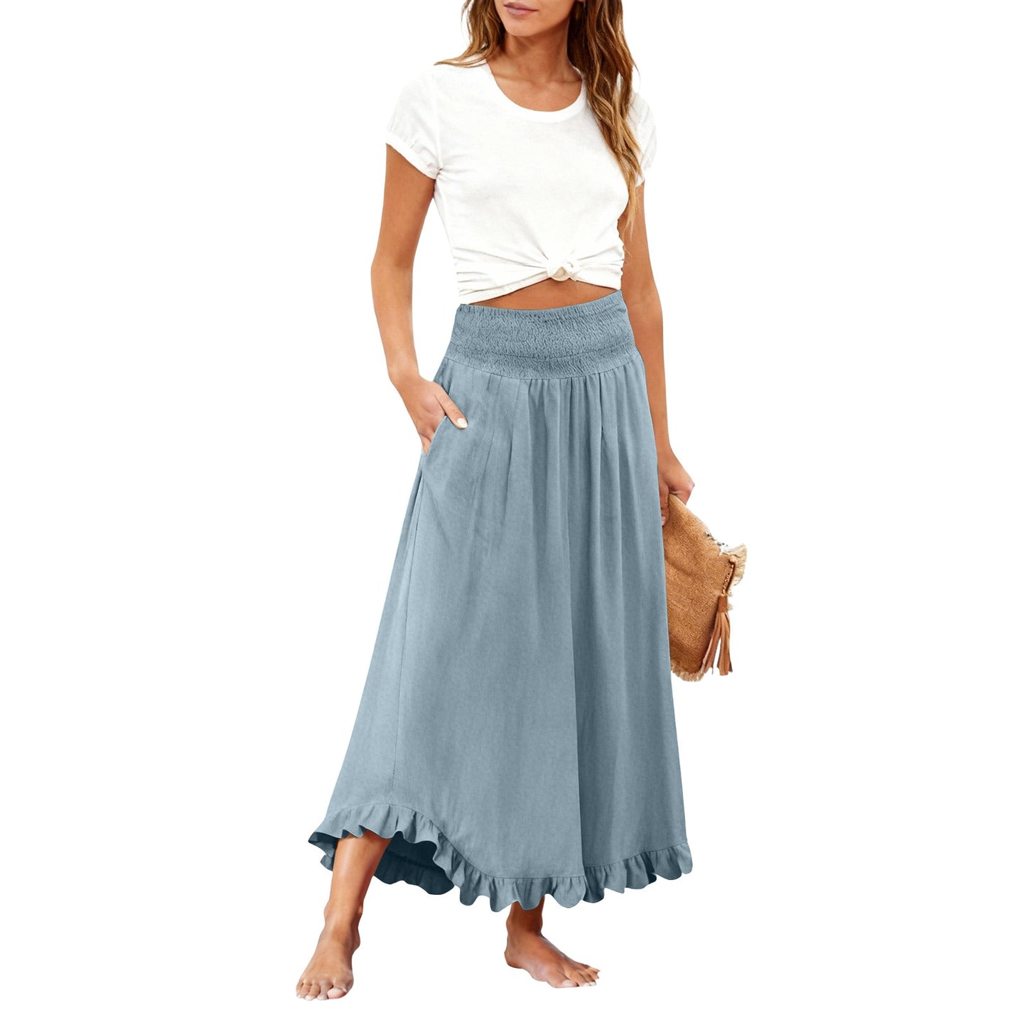Woman wearing a white top and blue skirt on a white background