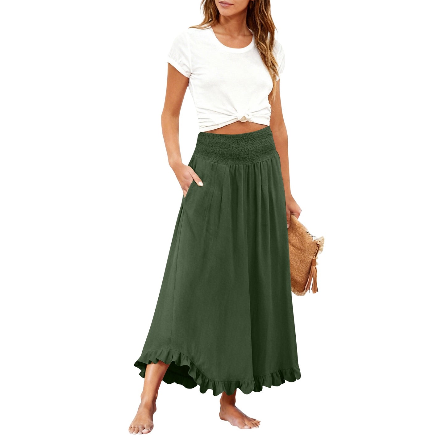 Woman wearing a white top and green skirt on a white background