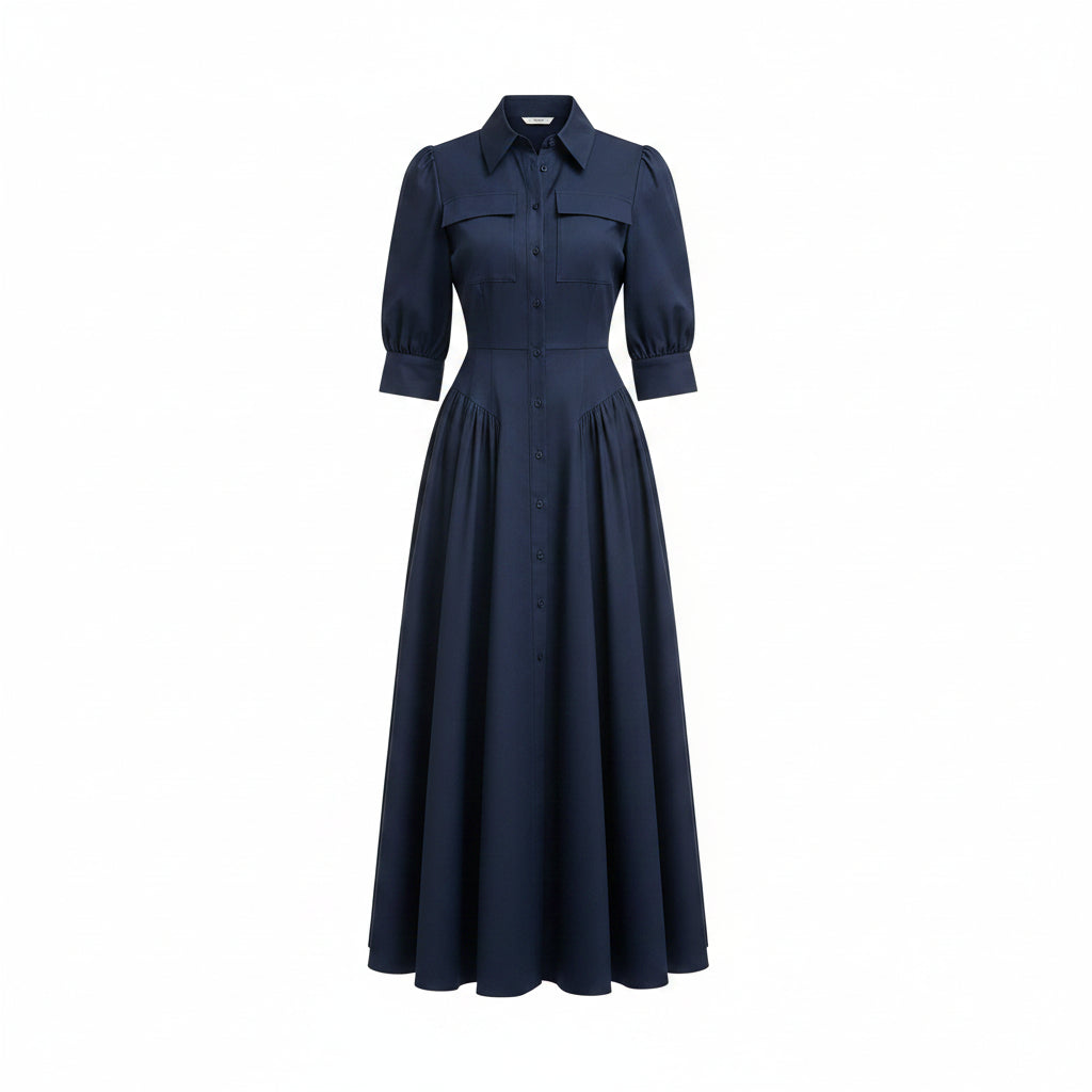 Woman wearing a navy blue dress in an indoor setting